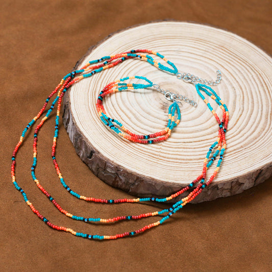 Sunset Glow Beaded Necklace And Bracelets Set – Multi-Strand with Red, Orange, and Turquoise Beads
